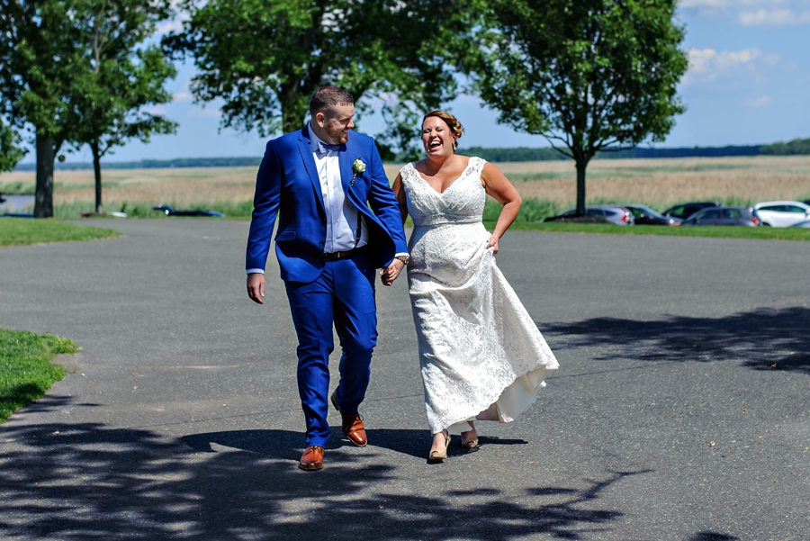 A bride being let by her brother to her first look before the wedding ceremony.